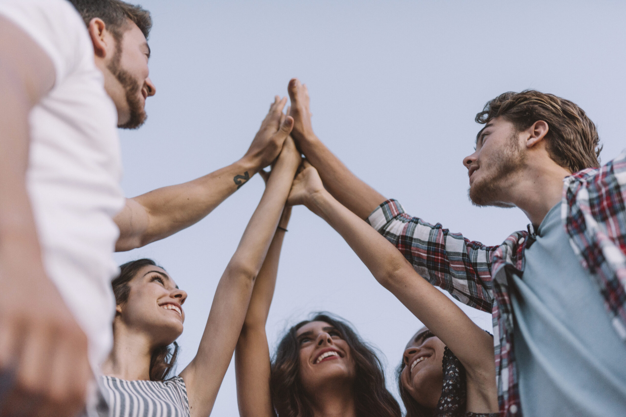 five-friends-clapping-hands